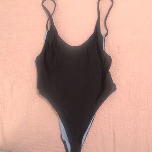 Never worn, reversible one piece.
